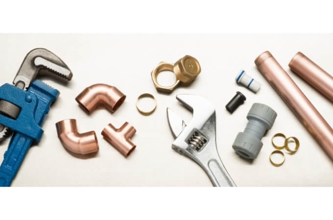 plumbing-tools-on-a-table-with-copper-fittings-fix-a-leaking-tap