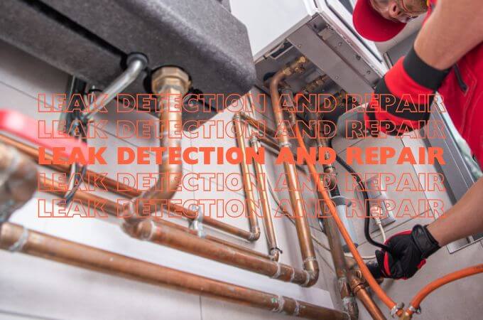 plumber-looking-for-leak-below-hot-water-heater