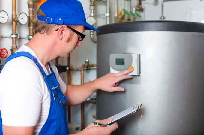 plumber-inspecting-hot-water-heater